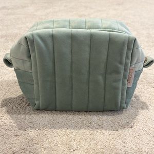 Biossance velvet makeup bag